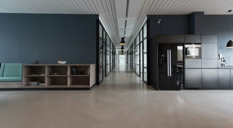 Modern open-plan office with desks and natural light