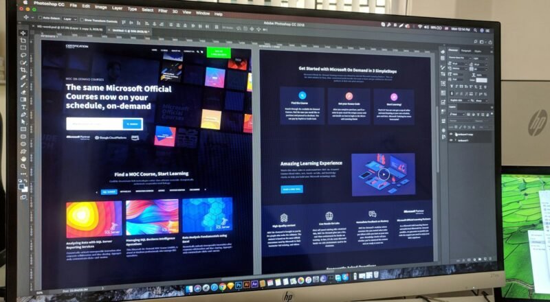 Mobile phone on top of paper wireframes